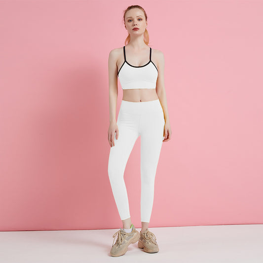 White sports bra and leggings set on model, front view