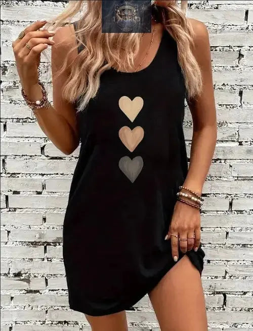Front view of a classic black sleeveless tank dress featuring a stylish triple heart graphic print - Soft, breathable crew neck mini dress for women - Effortless summer street style - ALL IN 1 WORLD