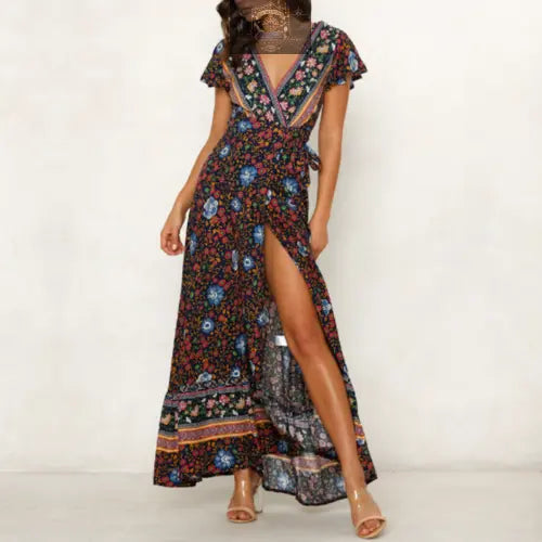 Front centered view of a navy blue floral wrap maxi dress with a plunging V-neck and high leg slit - Elegant bohemian summer long dress for women - ALL IN 1 WORLD