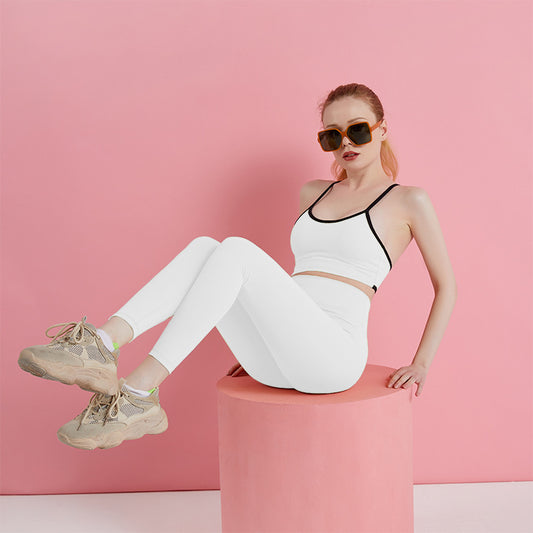 White two-piece yoga set on model, seated