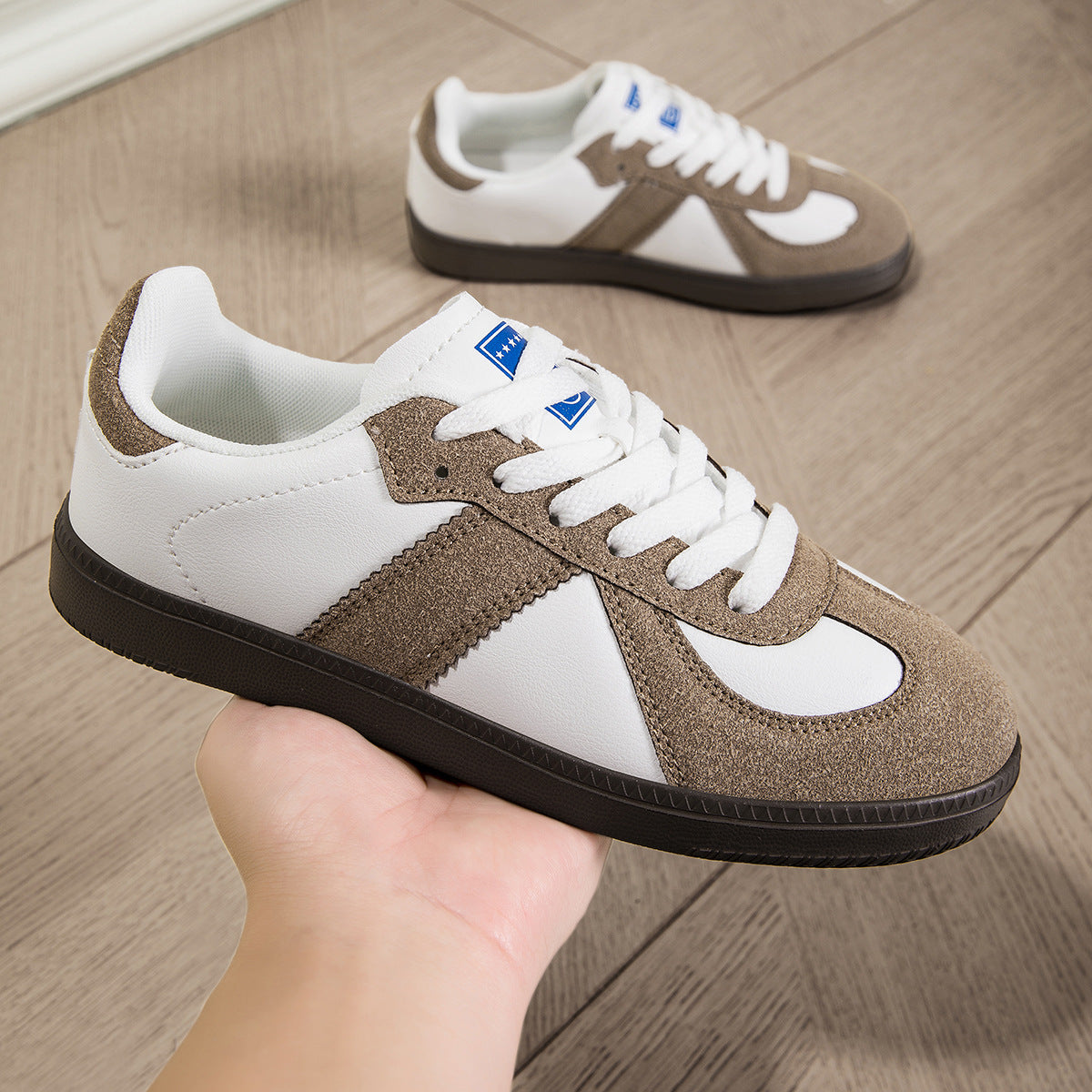 Low-top lace-up casual sneaker, angle view