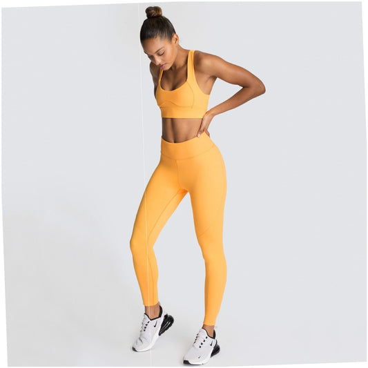 Orange sleeveless yoga set on model