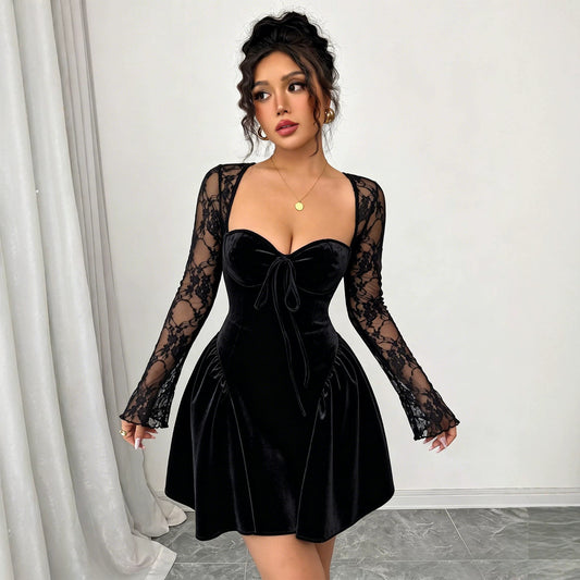 Woman wearing a black dress with long lace sleeves