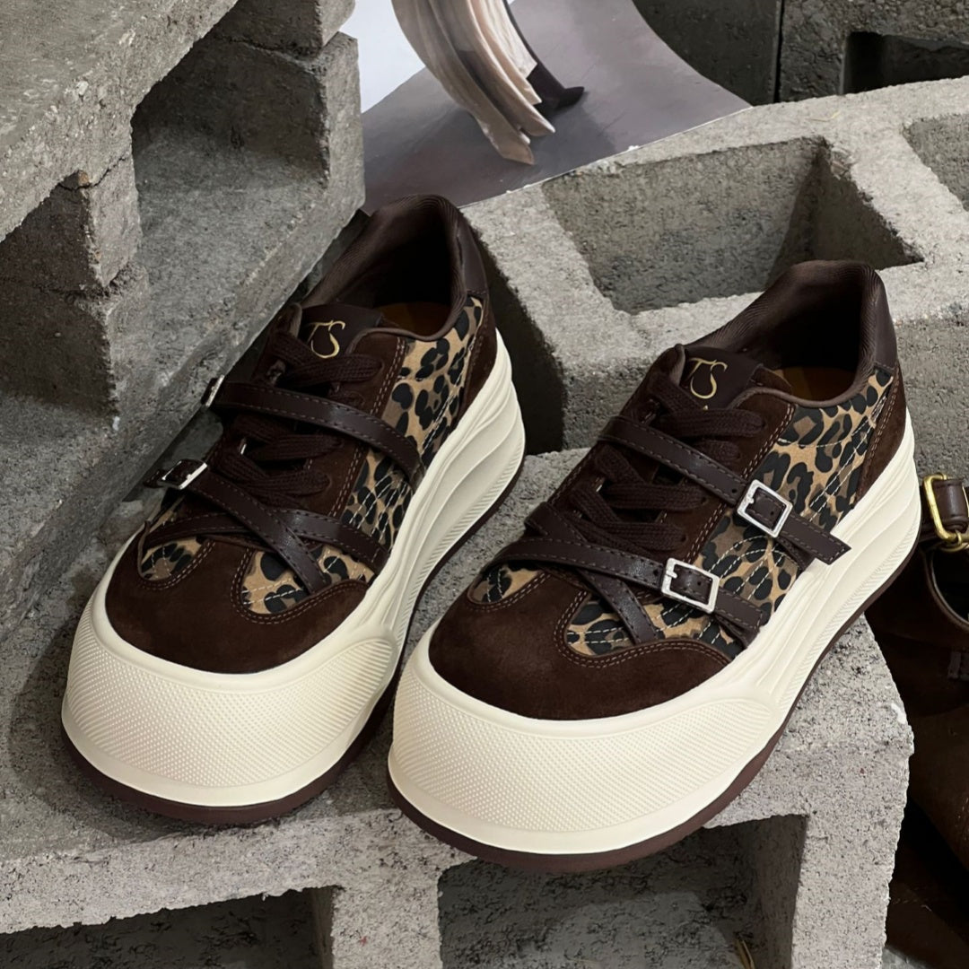 Pair of brown sneakers with leopard-print sides and buckles