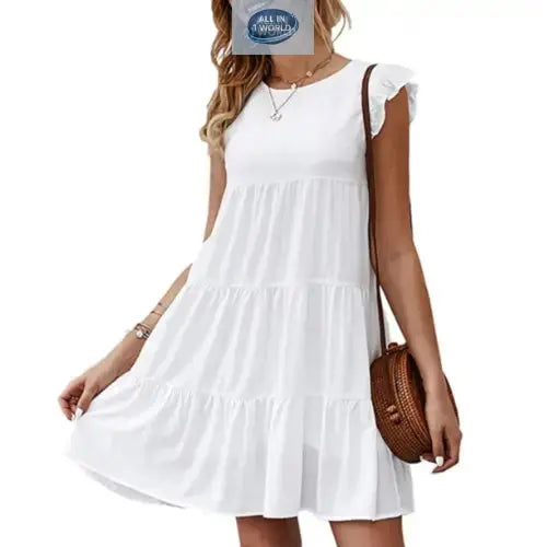 Short pure white flowy tiered dress for women with ruffled cap sleeves and round neckline - Elegant lightweight summer mini dress styled with a round brown bag - ALL IN 1 WORLD