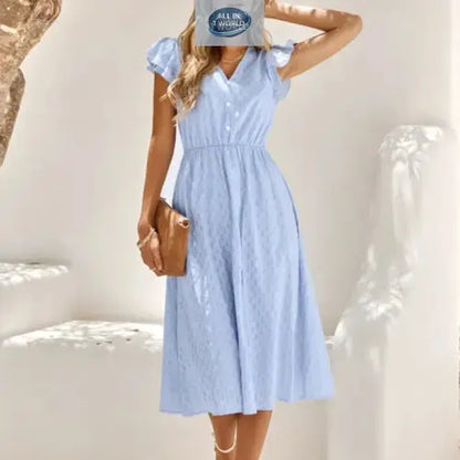 Full front view of a serene sky blue Swiss dot midi dress featuring ruffled cap sleeves and a V-neckline - Flowy summer A-line dress for women with an elasticated waist - Elegant and breathable vacation style - ALL IN 1 WORLD