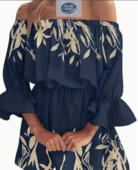 Close-up of a navy blue off-shoulder boho dress with cream leaf graphic prints - Featuring an elasticated neckline and ruffled flare sleeves - Elegant sexy backless summer style - ALL IN 1 WORLD